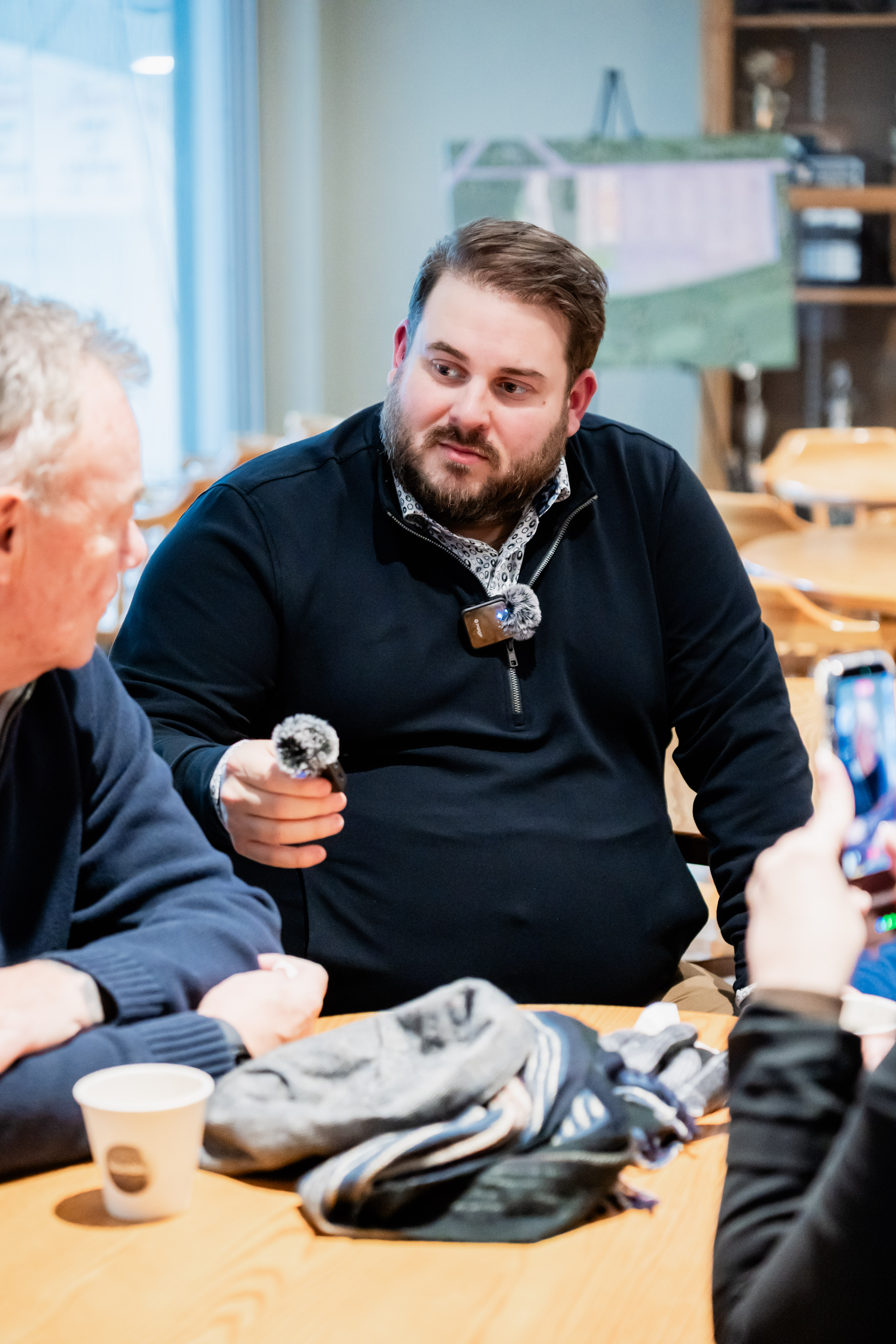 Dorian Hartley speaking with a neighbour at a community event
